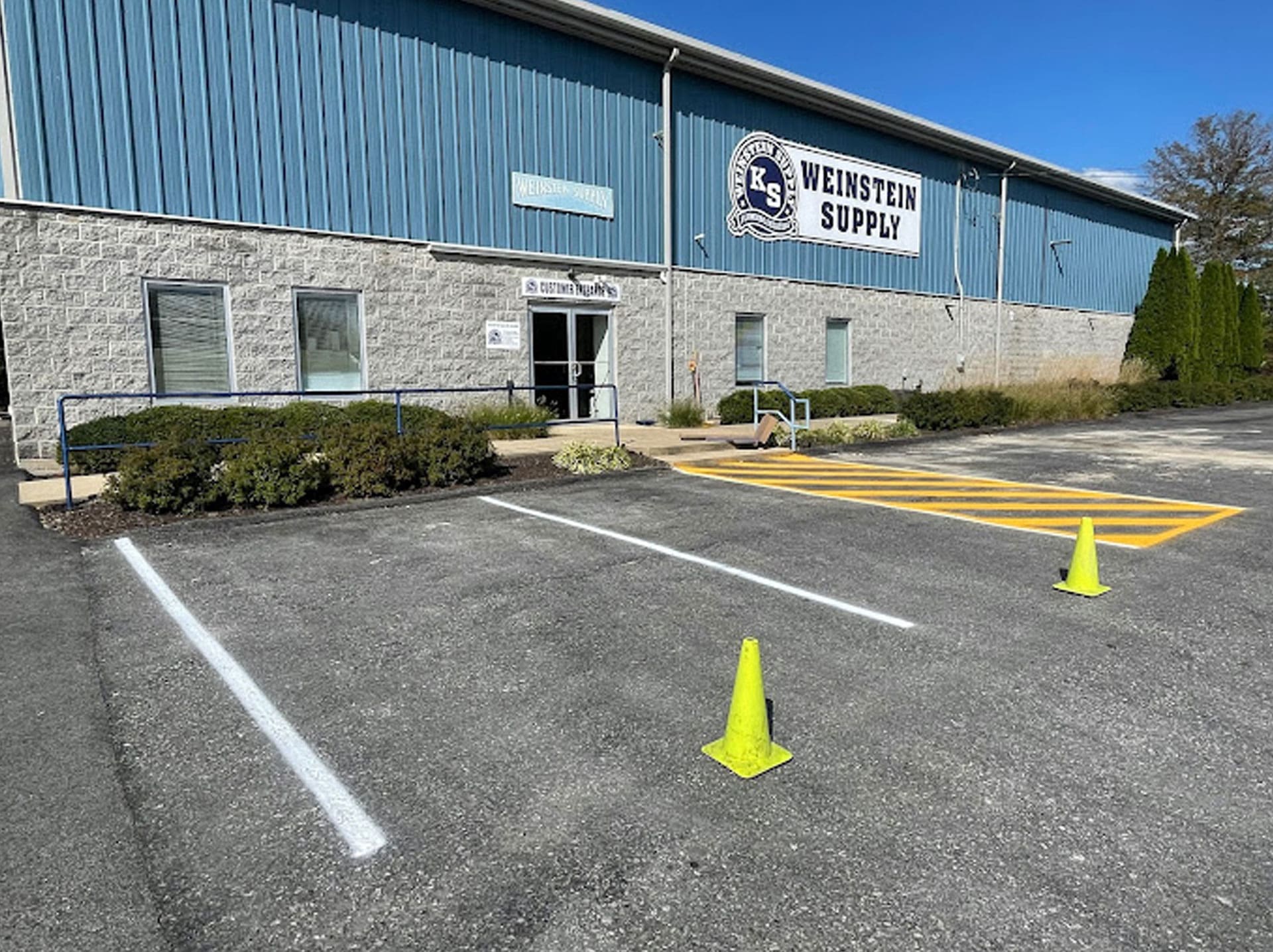 Weinstein PLumbing Supply Kennett Square PA building front and parking lot