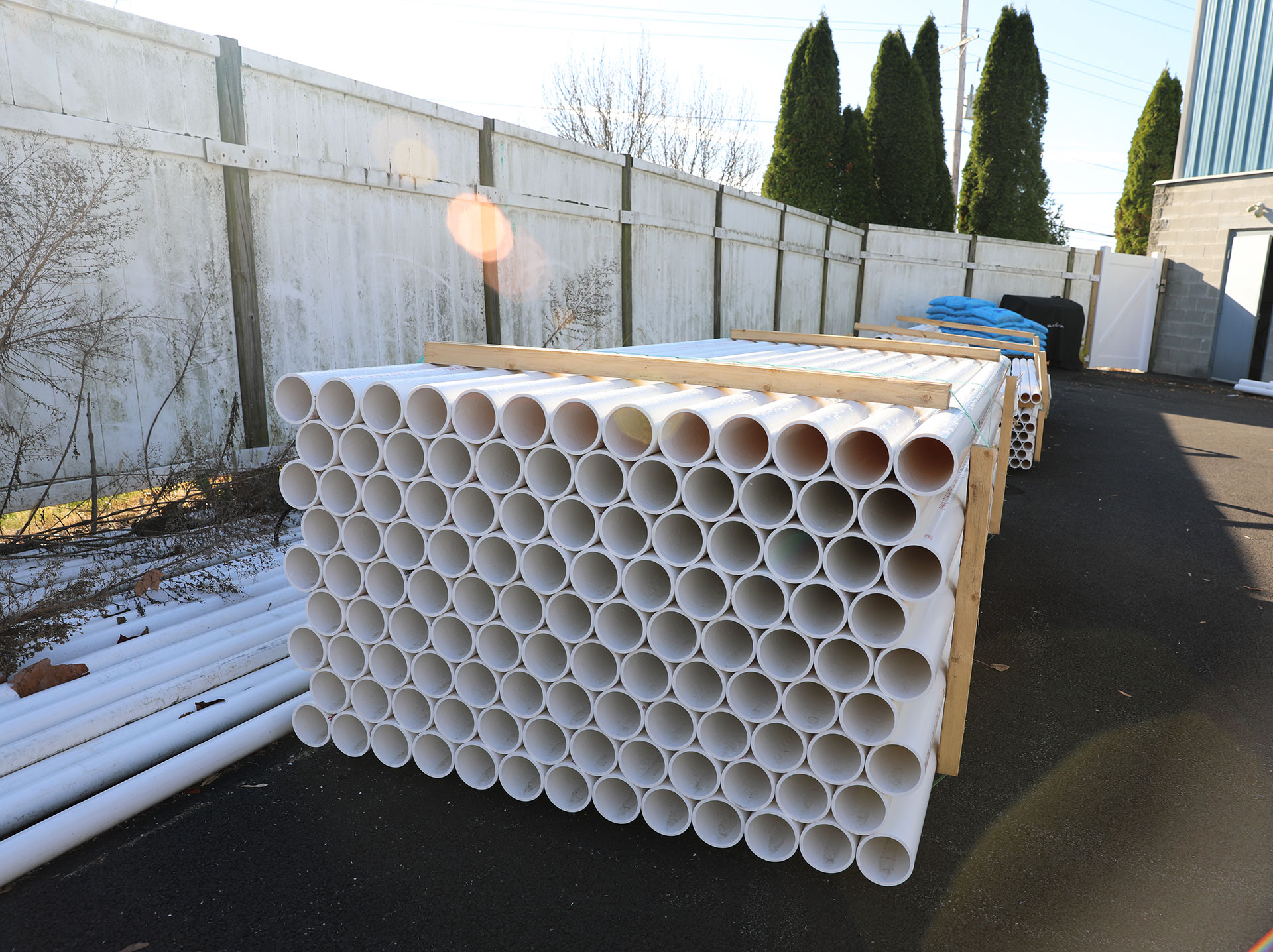 PVC pipes stacked in the back lot at Weinstein Plumbing Supply Kennett Square PA