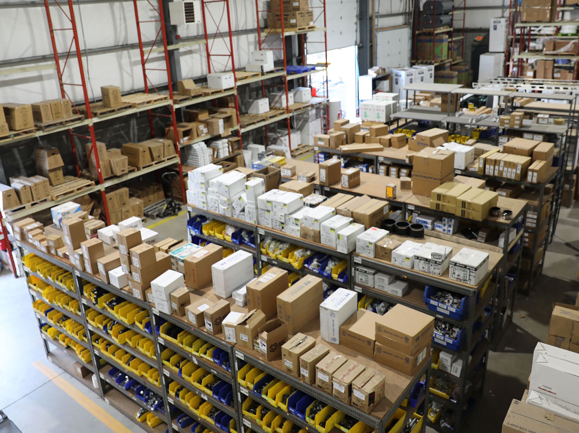 Plumbing supplies on shelves in warehouse at Weinstein Plumbing Supply Kennett Square PA