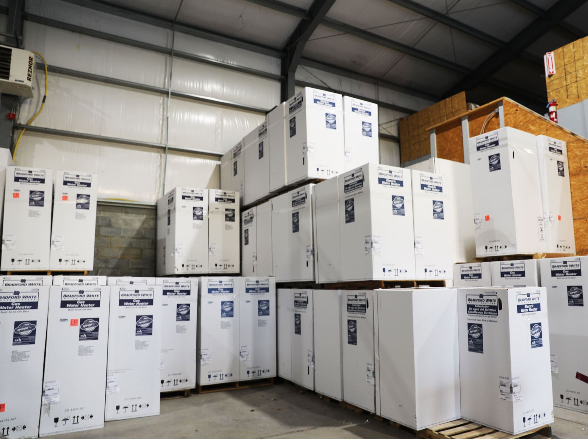 Boxed water heaters stacked in the warehouse at Weinstein Plumbing Supply Kennett Square PA